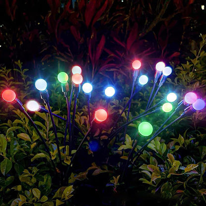 Select Society Solar Garden Lights installed in a lush garden, providing ambient warm light for evening enjoyment.
