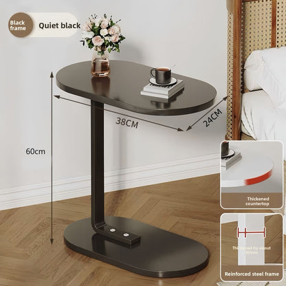 Detail view of the Select Society Adjustable Sofa Side Table's stable base, designed for easy placement under furniture.