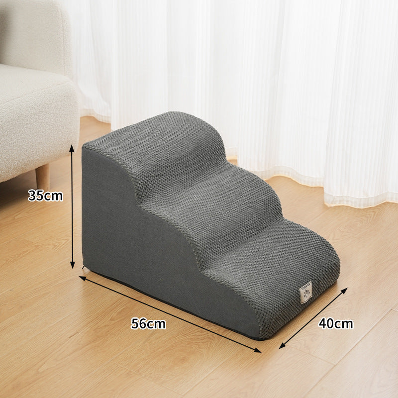 Select Society Pet Stairs positioned next to a bed, providing a safe and stylish solution for pets to reach elevated spaces.