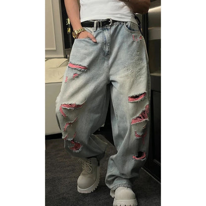 Close-up of the waist and button closure on Select Society's Dragon Embroidered Blue Jeans, indicating quality.
