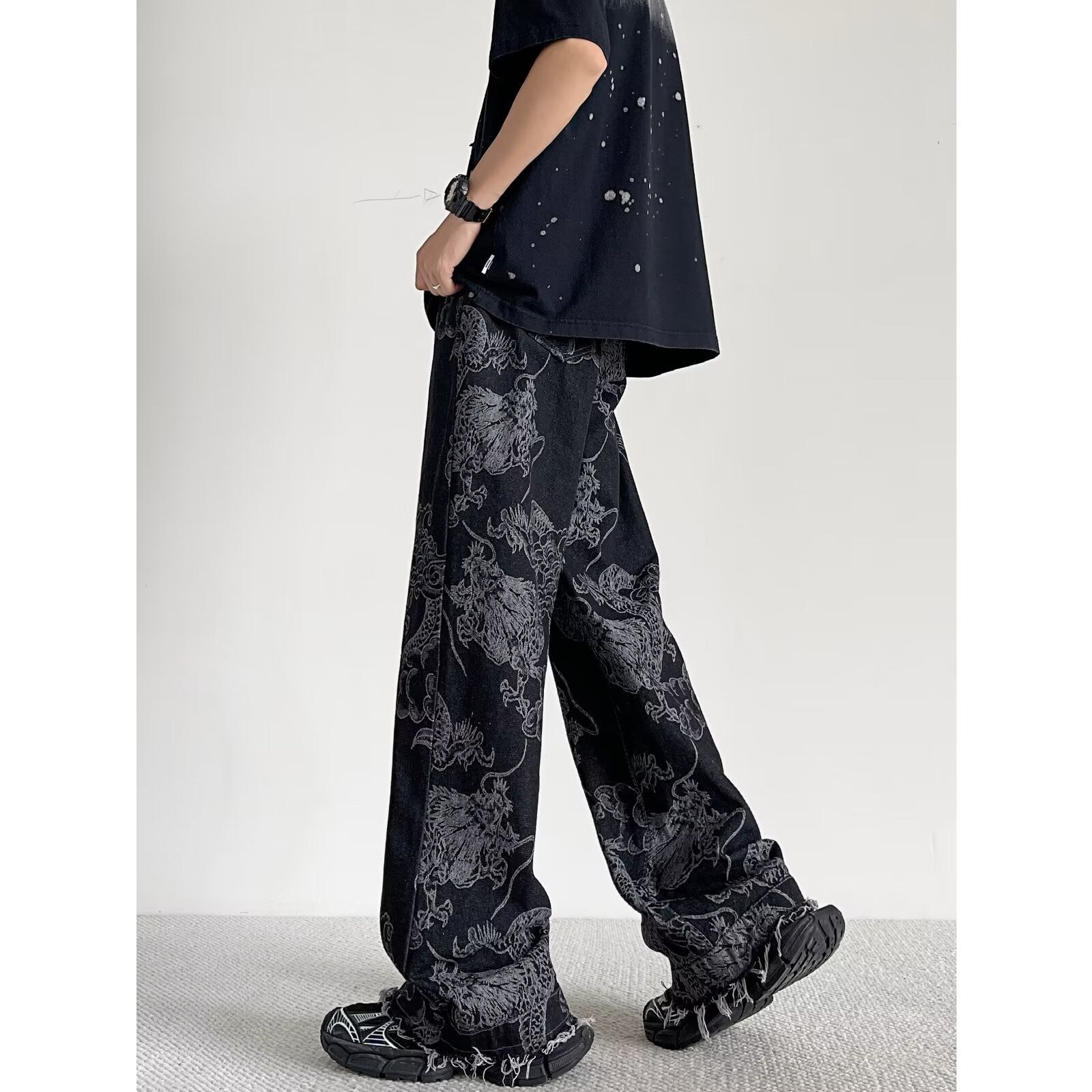 Stylish individual wearing Select Society Dragon Embroidered Black Jeans, demonstrating a modern, comfortable fit.