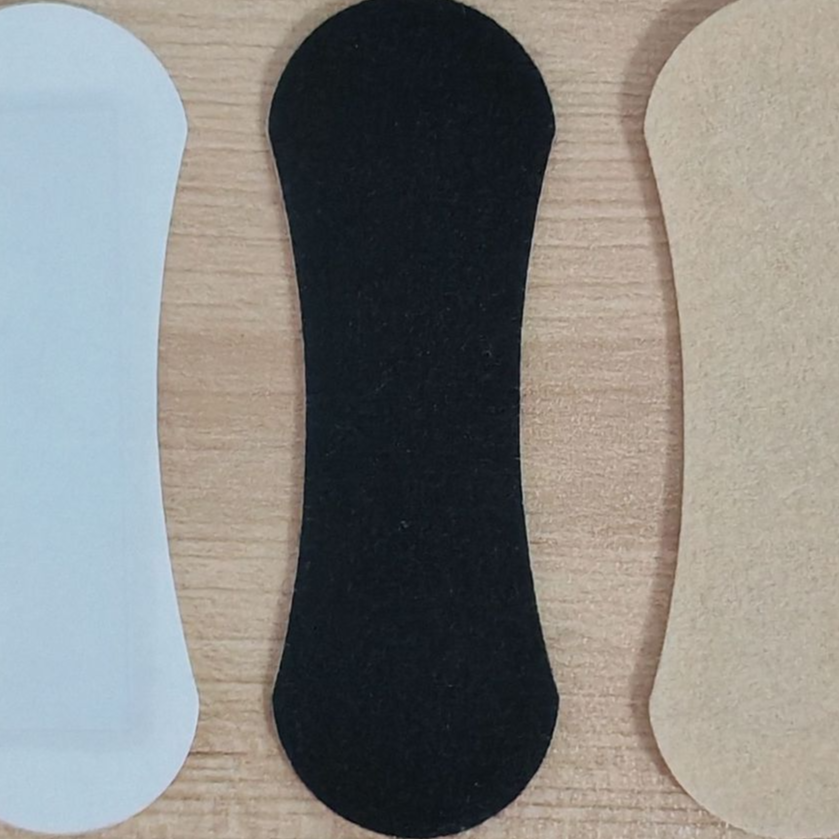 Detail shot of a single Select Society Nasal Strip, emphasizing its breathable material and secure fit.