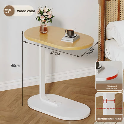 The Select Society Adjustable Sofa Side Table 60cm, demonstrating its versatility in a contemporary living space.